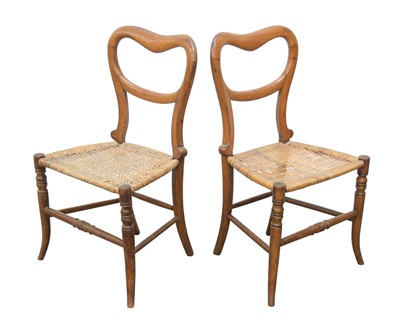 Lot 118 - A pair of Victorian mahogany and cane dish backed child chairs.