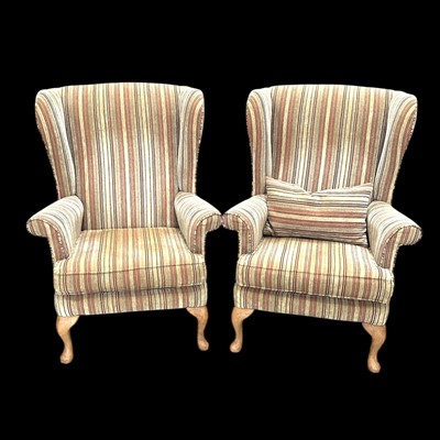 Lot 20 - A pair of Parker Knoll wingback chairs.