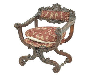 Lot 864 - A walnut Savonarola chair.