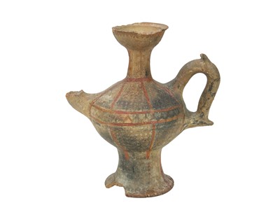 Lot 141 - A Near Eastern terracotta spouted jar.