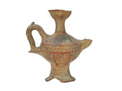 Lot 141 - A Near Eastern terracotta spouted jar.
