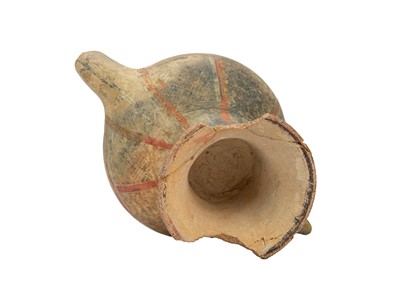 Lot 141 - A Near Eastern terracotta spouted jar.