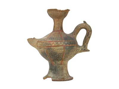 Lot 141 - A Near Eastern terracotta spouted jar.