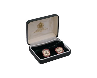 Lot 41 - A pair of sterling silver-gilt red enamel MBE cufflinks, by Toye, Kenning & Spencer Ltd.
