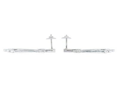 Lot A fine pair of Art Deco 18k and platinum diamond set drop pendant earrings.