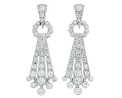 Lot A fine pair of Art Deco 18k and platinum diamond set drop pendant earrings.