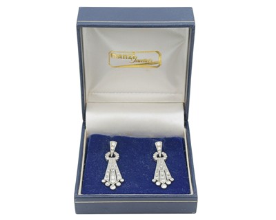 Lot A fine pair of Art Deco 18k and platinum diamond set drop pendant earrings.
