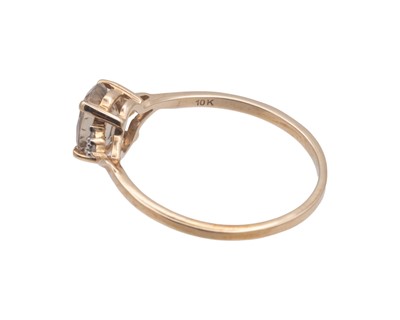 Lot 33 - A 9k diamond and oval Csarite ( Diaspore) set ring by Gemporia.
