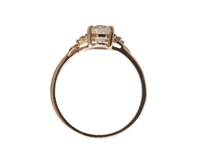 Lot 33 - A 9k diamond and oval Csarite ( Diaspore) set ring by Gemporia.