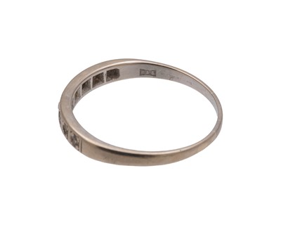 Lot 35 - A high-purity white gold diamond set half eternity ring.