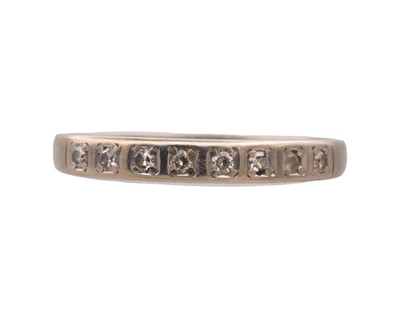 Lot 35 - A high-purity white gold diamond set half eternity ring.