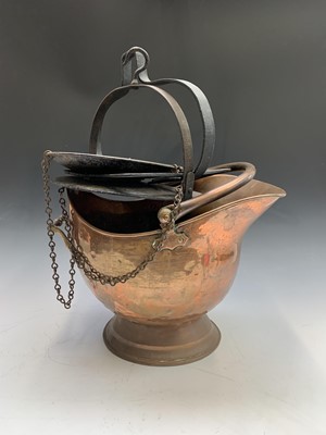 Lot 73 - A 19th century copper helmet shape coal scutle,...