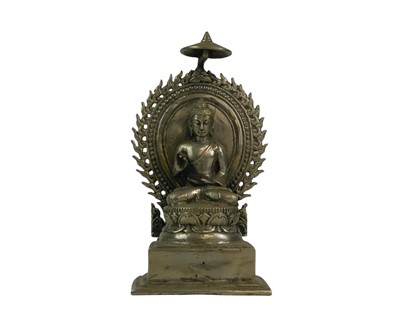 Lot 444 - A white metal alloy figure of Gautama Buddha.
