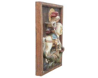 Lot 111 - A carved relief panel of St George and the dragon.