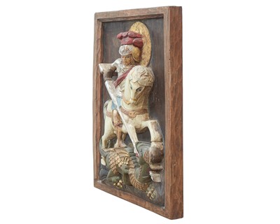 Lot 111 - A carved relief panel of St George and the dragon.