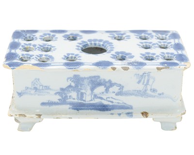 Lot 711 - A rare English Delft flower brick.