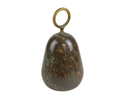 Lot 74 - A Cornish serpentine door stop with brass loop handle.
