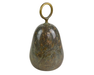 Lot 74 - A Cornish serpentine door stop with brass loop handle.