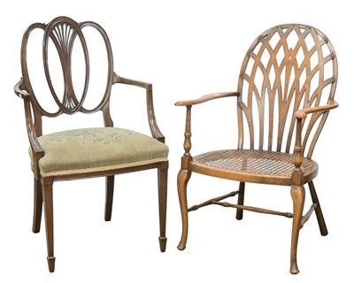 Lot 844 - A Hepplewhite style mahogany elbow chair.