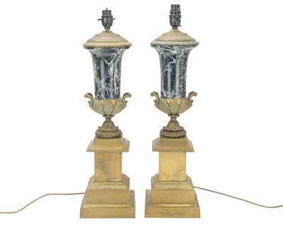Lot 806 - An ornate pair of French brass and black marble table lamps.
