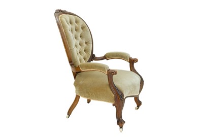 Lot 897 - A mid Victorian walnut framed button back armchair.