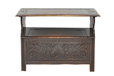 Lot 890 - A carved oak Monk's bench.
