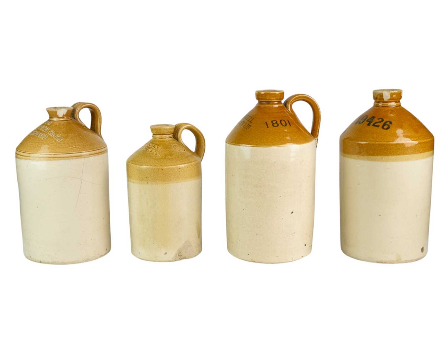 Lot 30 - Four Cornish stoneware flagons.