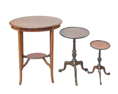 Lot 921 - Two mahogany tripod wine tables.