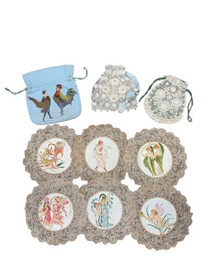 Lot 352 - A collection of hand painted lace doilies.