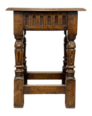 Lot 700 - A 17th century style oak joint stool.