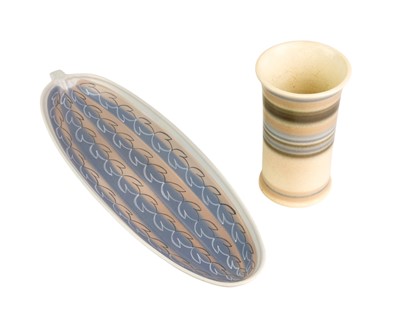 Lot 584 - A Poole pottery freeform cucumber dish.