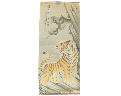 Lot 411 - A Japanese silk scroll painting.