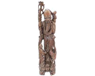 Lot 448 - A Chinese carved wood figural lamp base.
