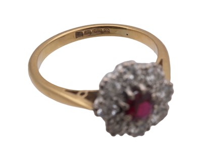 Lot 22 - An attractive early 20th-century 18k yellow and white gold ruby and diamond set cluster ring.