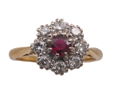 Lot 22 - An attractive early 20th-century 18k yellow and white gold ruby and diamond set cluster ring.