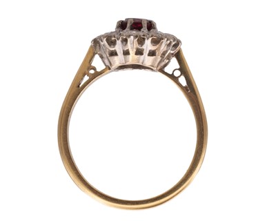 Lot 22 - An attractive early 20th-century 18k yellow and white gold ruby and diamond set cluster ring.