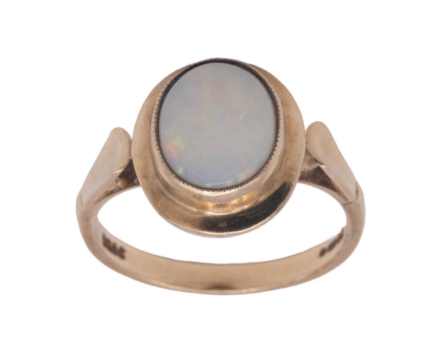 Lot 43 - A 9k hallmarked gold oval white opal set ring.