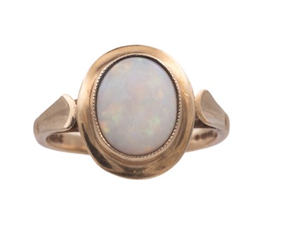 Lot 43 - A 9k hallmarked gold oval white opal set ring.