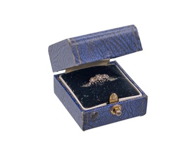 Lot 36 - An 18k and platinum diamond set three-stone ring.