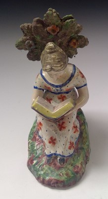 Lot 829 - A 19th century Staffordshire figure of a girl...