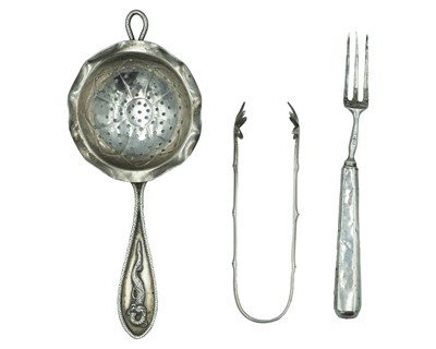 Lot 365 - An asian silver tea strainer.