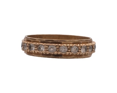 Lot 30 - A 9k band ring, and a 9k white spinel set eternity ring.