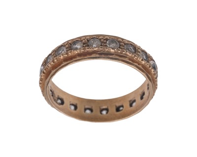 Lot 30 - A 9k band ring, and a 9k white spinel set eternity ring.