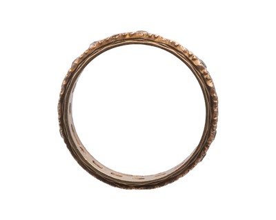 Lot 30 - A 9k band ring, and a 9k white spinel set eternity ring.