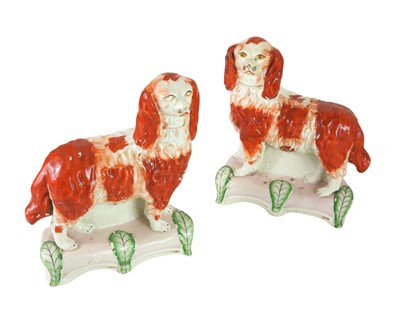 Lot 683 - A rare pair of Staffordshire spaniels.