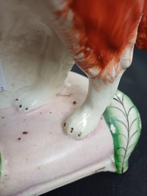 Lot 683 - A rare pair of Staffordshire spaniels.