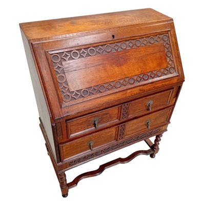 Lot 92 - An Oak Bureau with carved detail. 40 x 76 x...