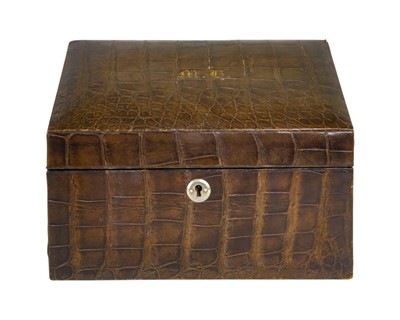 Lot 106 - An early 20th century crocodile hide covered stationery box.