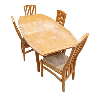 Lot 13 - A Blonde Oak extending Dining Table and Four...