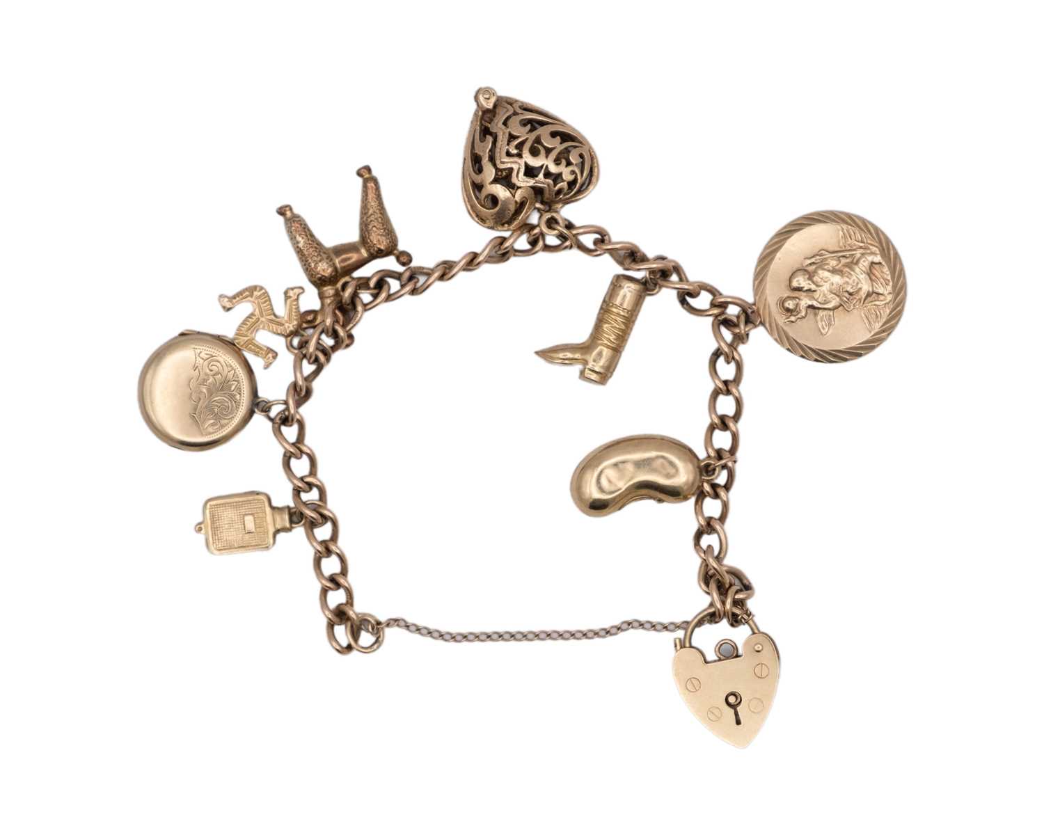 Lot 44 - A 9k charm bracelet with eight various 9k charms and padlock clasp.